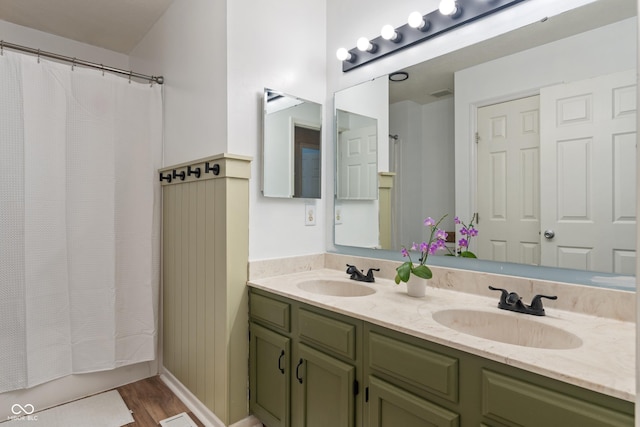 8376 Glen Highlands Dr, Indianapolis, IN 46236 - full bath with double vanity, wood finished floors, and a shower with curtain