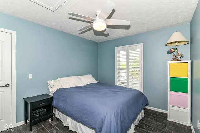 18967 Mill Grove Dr, Noblesville, IN 46062 - bedroom with a textured ceiling, baseboards, wood finish floors, a ceiling fan, and attic access