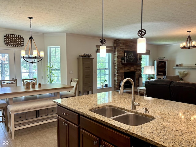 11700 Harvest Moon Dr, Noblesville, IN 46060 - kitchen with a chandelier, plenty of natural light, a textured ceiling, and ornamental molding