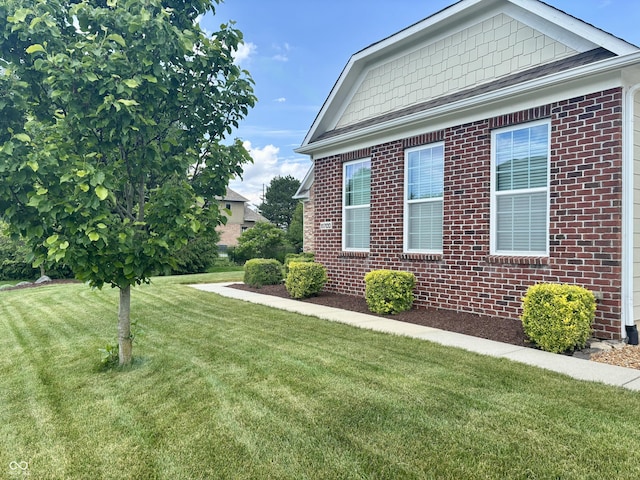 11700 Harvest Moon Dr, Noblesville, IN 46060 - view of property exterior featuring brick siding and a yard