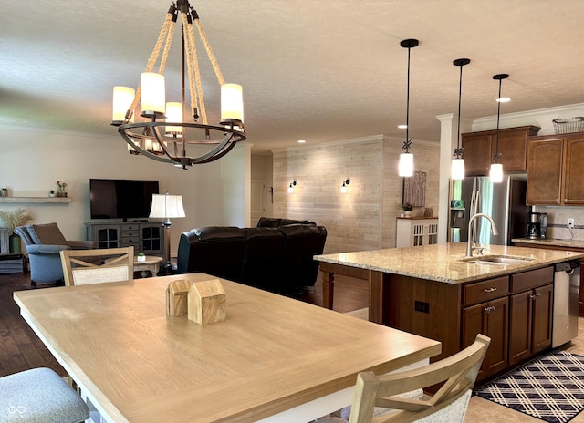 11700 Harvest Moon Dr, Noblesville, IN 46060 - dining area with a chandelier, ornamental molding, a textured ceiling, and dark wood-style floors
