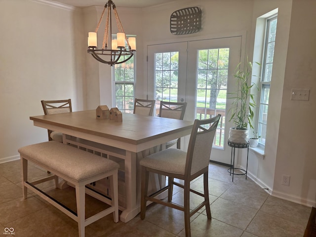 11700 Harvest Moon Dr, Noblesville, IN 46060 - dining space with a chandelier, tile patterned floors, ornamental molding, and french doors