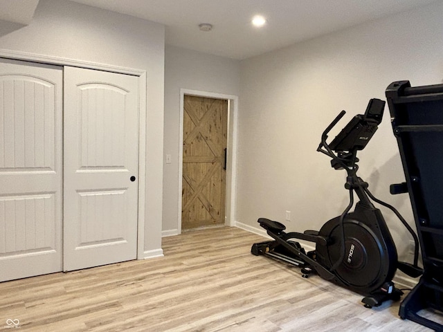 11700 Harvest Moon Dr, Noblesville, IN 46060 - exercise room featuring light wood-style flooring and recessed lighting