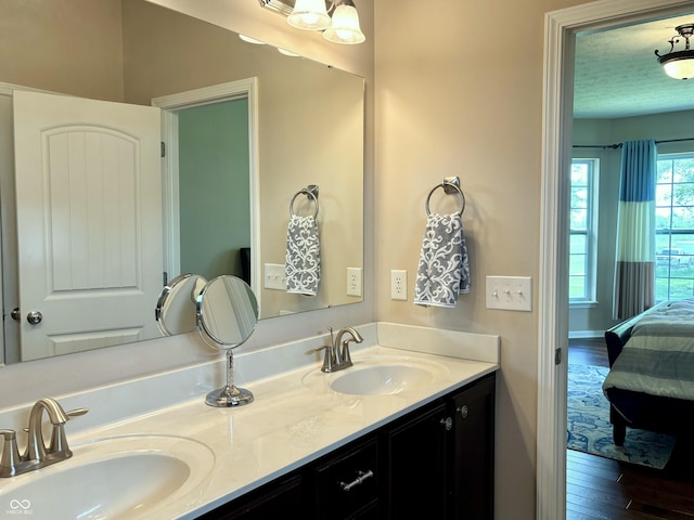 11700 Harvest Moon Dr, Noblesville, IN 46060 - ensuite bathroom with double vanity and wood finished floors