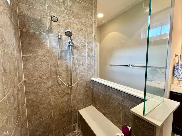 11700 Harvest Moon Dr, Noblesville, IN 46060 - bathroom featuring tiled shower, tile walls, and recessed lighting