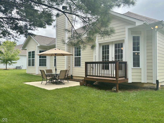 11700 Harvest Moon Dr, Noblesville, IN 46060 - rear view of property featuring a patio area, a yard, a shingled roof, and a chimney