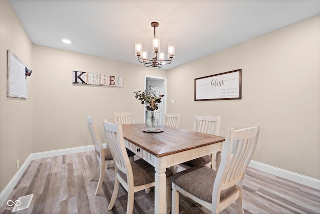 213 Terre Vista Dr, Terre Haute, IN 47803 - dining room featuring a chandelier, baseboards, light wood-style flooring, and recessed lighting