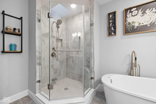 213 Terre Vista Dr, Terre Haute, IN 47803 - full bathroom featuring a freestanding tub, a stall shower, and baseboards