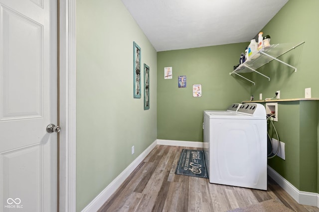 213 Terre Vista Dr, Terre Haute, IN 47803 - laundry room with washer and dryer, wood finished floors, and baseboards