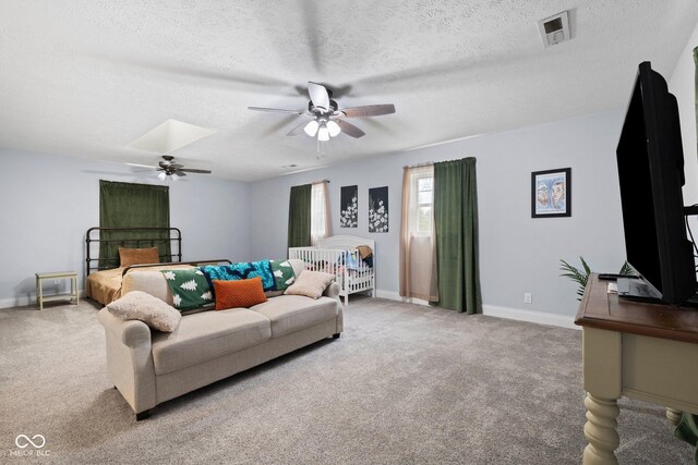 213 Terre Vista Dr, Terre Haute, IN 47803 - living area featuring a ceiling fan, carpet floors, a textured ceiling, and baseboards