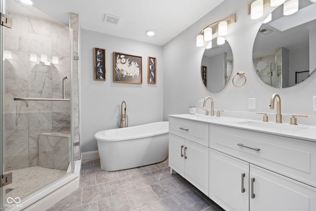 213 Terre Vista Dr, Terre Haute, IN 47803 - full bath with double vanity, a stall shower, a soaking tub, baseboards, and recessed lighting
