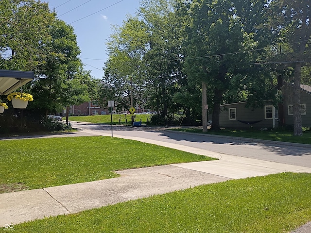1008 E 61st St, Indianapolis, IN 46220 - view of asphalt road featuring sidewalks and traffic signs