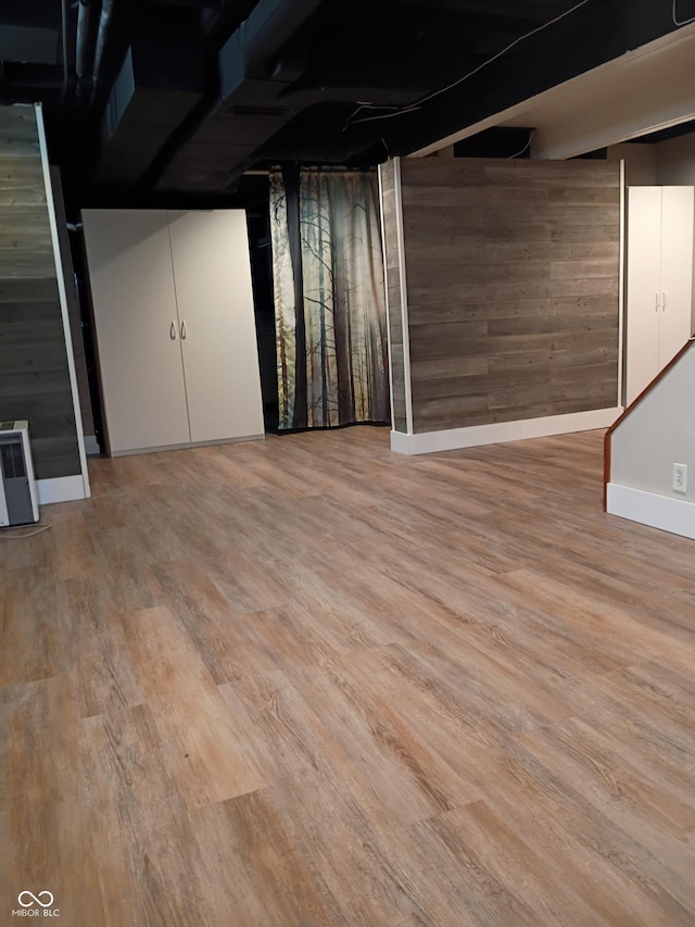 1008 E 61st St, Indianapolis, IN 46220 - finished below grade area featuring baseboards, wooden walls, and wood finished floors