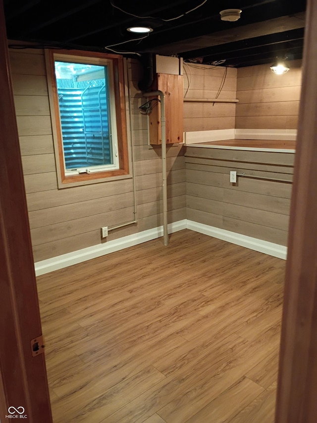 1008 E 61st St, Indianapolis, IN 46220 - finished basement featuring baseboards, wood finished floors, and wooden walls