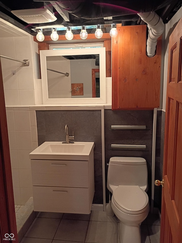 1008 E 61st St, Indianapolis, IN 46220 - bathroom with vanity, tile patterned flooring, and toilet