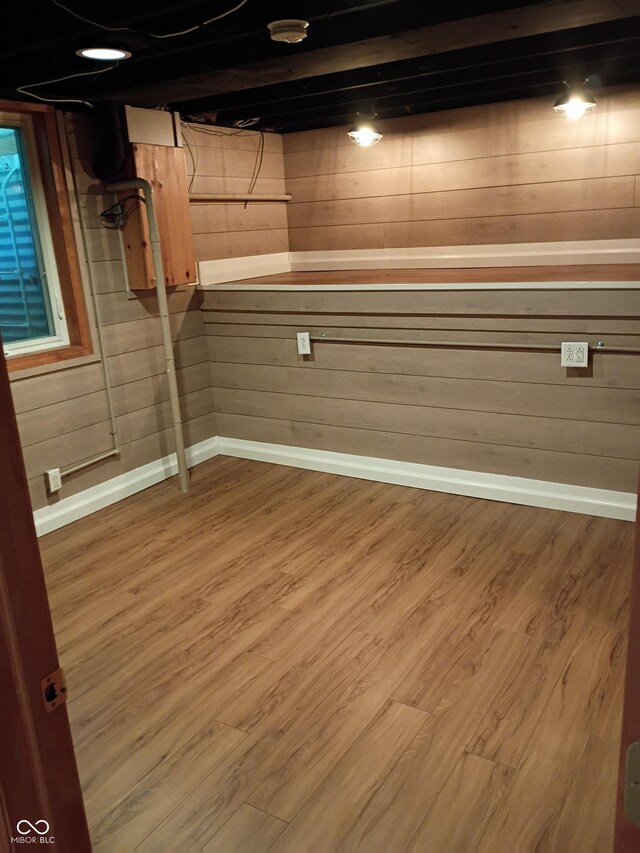 1008 E 61st St, Indianapolis, IN 46220 - below grade area with wood finished floors, baseboards, and wood walls