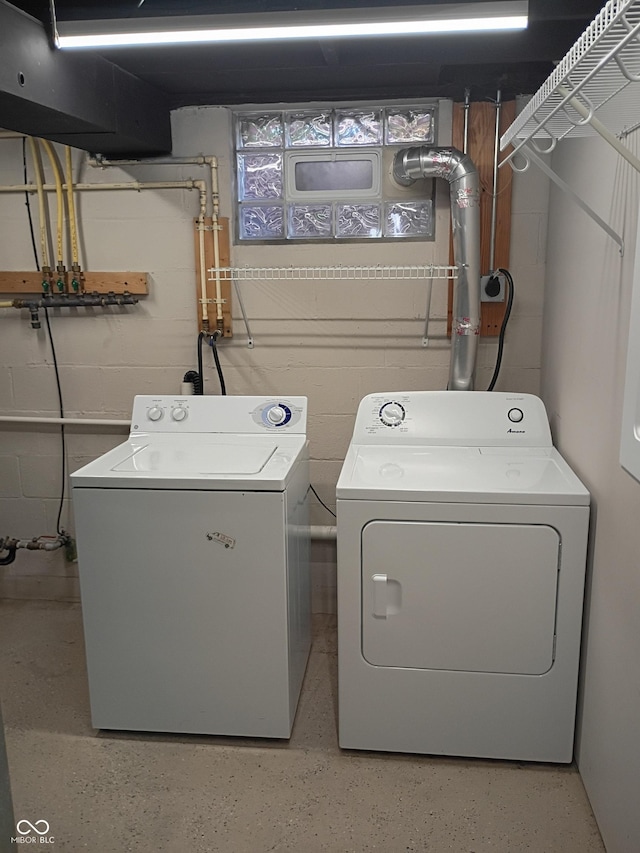1008 E 61st St, Indianapolis, IN 46220 - laundry area with washing machine and clothes dryer and concrete block wall