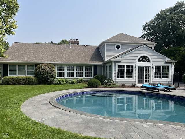 9510 Copley Dr, Indianapolis, IN 46260 - swimming pool featuring a lawn, a patio, and outdoor lounge area