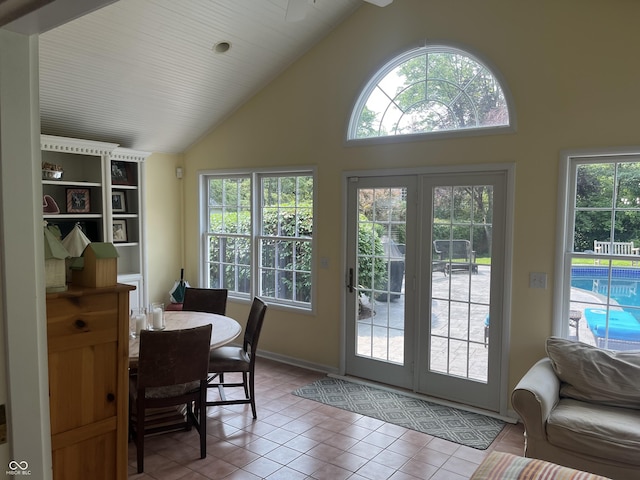 9510 Copley Dr, Indianapolis, IN 46260 - entryway featuring healthy amount of natural light, high vaulted ceiling, tile patterned floors, and baseboards