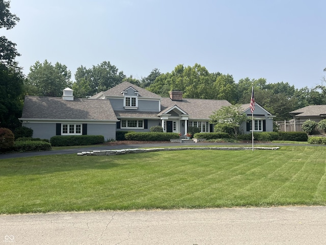 9510 Copley Dr, Indianapolis, IN 46260 - view of front of property featuring a chimney and a front yard