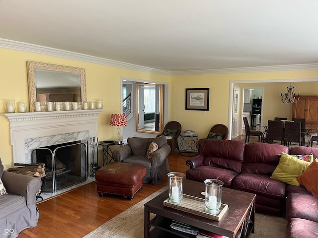 9510 Copley Dr, Indianapolis, IN 46260 - living area featuring crown molding, wood finished floors, and a high end fireplace