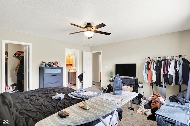 15264 Ten Point Dr, Noblesville, IN 46060 - bedroom with carpet flooring, ceiling fan, ensuite bathroom, and a textured ceiling