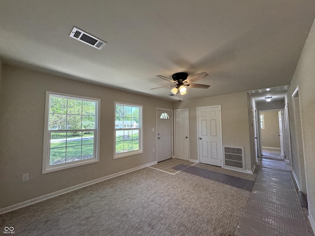 409 Parkway St, Whiteland, IN 46184 - carpeted foyer entrance featuring ceiling fan and baseboards