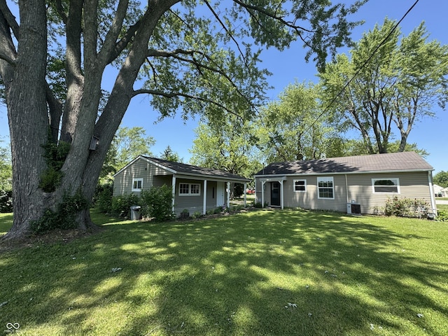 409 Parkway St, Whiteland, IN 46184 - rear view of house featuring a lawn and central air condition unit