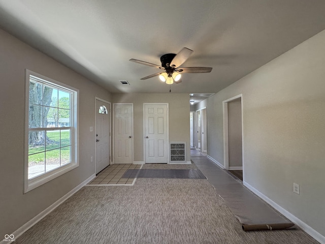 409 Parkway St, Whiteland, IN 46184 - entryway featuring carpet, baseboards, and ceiling fan