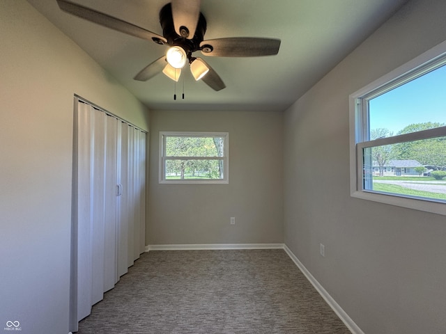409 Parkway St, Whiteland, IN 46184 - unfurnished bedroom with carpet floors, baseboards, a ceiling fan, and a closet