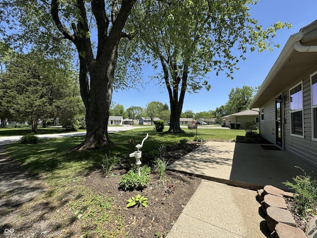 409 Parkway St, Whiteland, IN 46184 - view of grassy yard featuring a patio