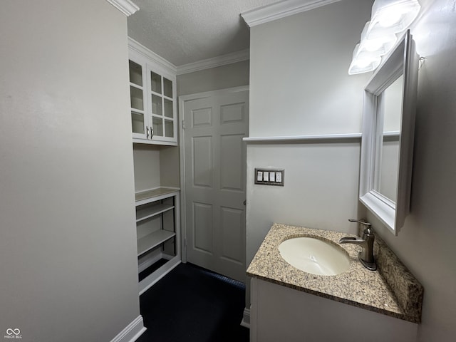 409 Parkway St, Whiteland, IN 46184 - bathroom with vanity, a textured ceiling, ornamental molding, and baseboards