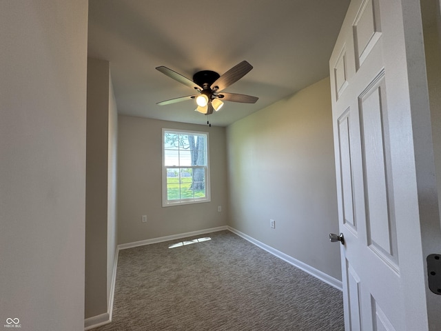 409 Parkway St, Whiteland, IN 46184 - unfurnished room with ceiling fan, dark colored carpet, and baseboards