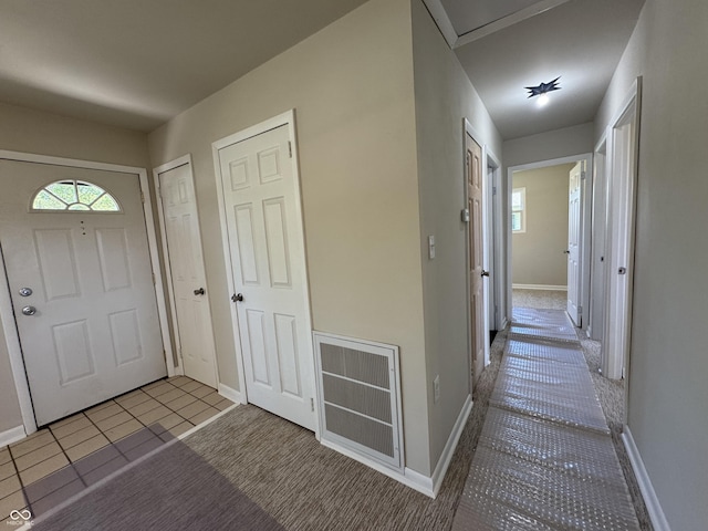 409 Parkway St, Whiteland, IN 46184 - tiled foyer featuring baseboards