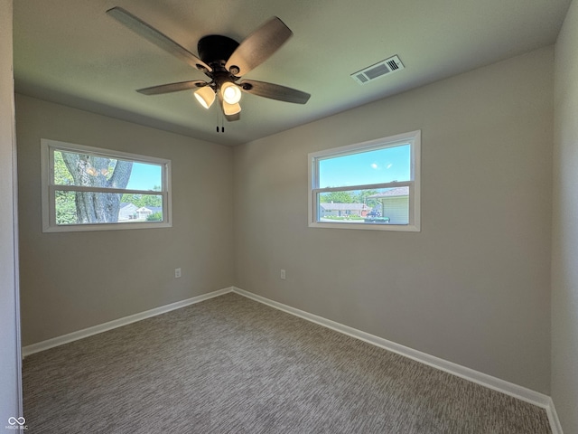 409 Parkway St, Whiteland, IN 46184 - carpeted empty room featuring healthy amount of natural light, ceiling fan, and baseboards