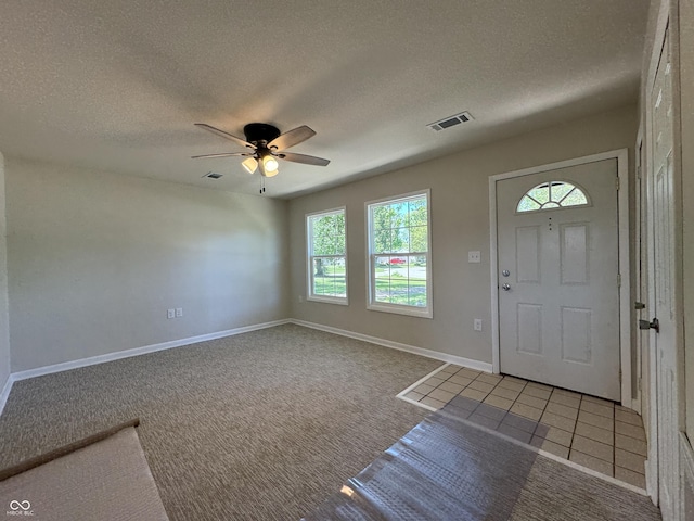409 Parkway St, Whiteland, IN 46184 - entrance foyer with a textured ceiling, ceiling fan, baseboards, and carpet floors
