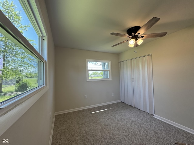 409 Parkway St, Whiteland, IN 46184 - unfurnished bedroom with carpet floors, baseboards, a ceiling fan, and a closet