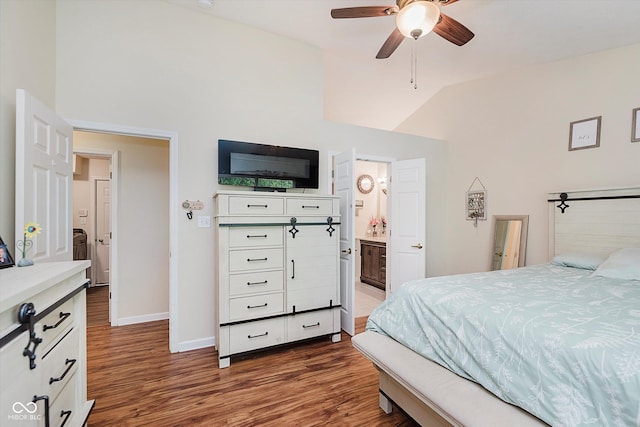 5939 Oberlies Way, Plainfield, IN 46168 - bedroom with dark wood finished floors, baseboards, lofted ceiling, ensuite bathroom, and ceiling fan