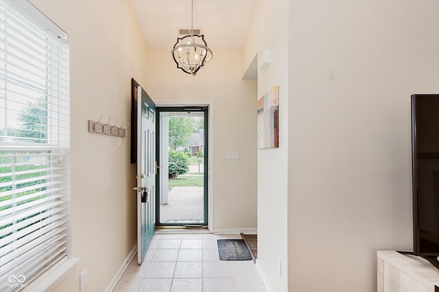 5939 Oberlies Way, Plainfield, IN 46168 - doorway to outside with a chandelier, light tile patterned floors, and baseboards