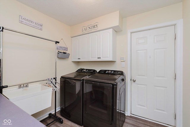 5939 Oberlies Way, Plainfield, IN 46168 - laundry room with washer and clothes dryer, cabinet space, and wood finished floors