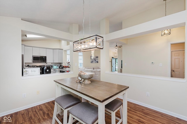 5939 Oberlies Way, Plainfield, IN 46168 - dining area featuring dark wood-style floors and baseboards