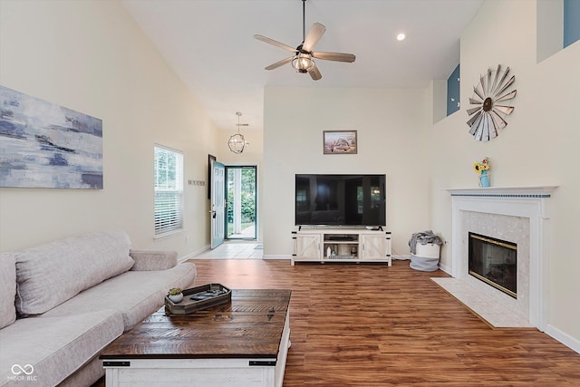 5939 Oberlies Way, Plainfield, IN 46168 - living area featuring high vaulted ceiling, wood finished floors, a ceiling fan, a high end fireplace, and baseboards