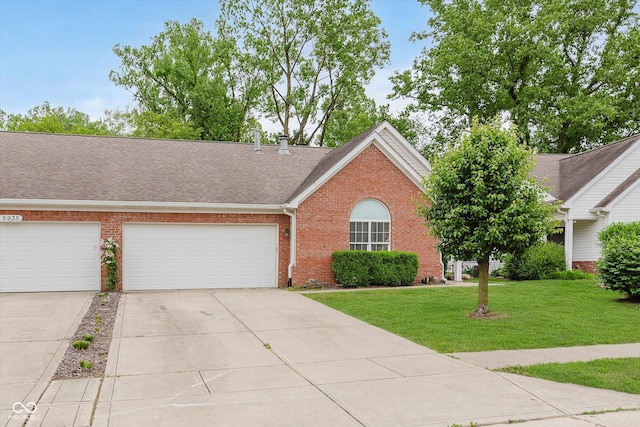 5939 Oberlies Way, Plainfield, IN 46168 - view of front of house featuring brick siding, driveway, a front lawn, an attached garage, and a shingled roof