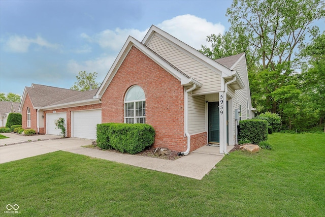 5939 Oberlies Way, Plainfield, IN 46168 - view of front of home featuring an attached garage, brick siding, a front yard, and driveway