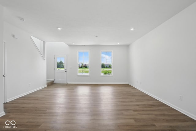 3931 Wren Dr, Brownsburg, IN 46112 - unfurnished living room featuring dark wood finished floors, baseboards, and recessed lighting