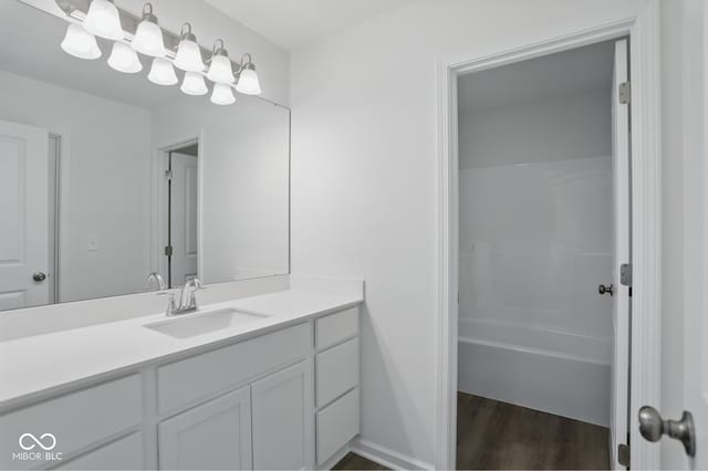 3931 Wren Dr, Brownsburg, IN 46112 - full bathroom featuring vanity, wood finished floors, and tub / shower combination