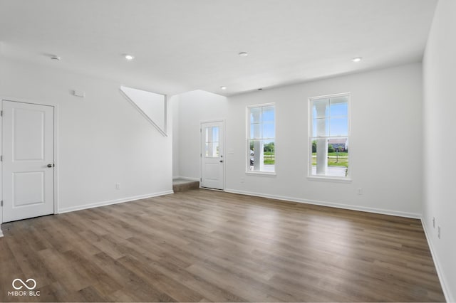 3931 Wren Dr, Brownsburg, IN 46112 - unfurnished living room with wood finished floors, baseboards, and recessed lighting