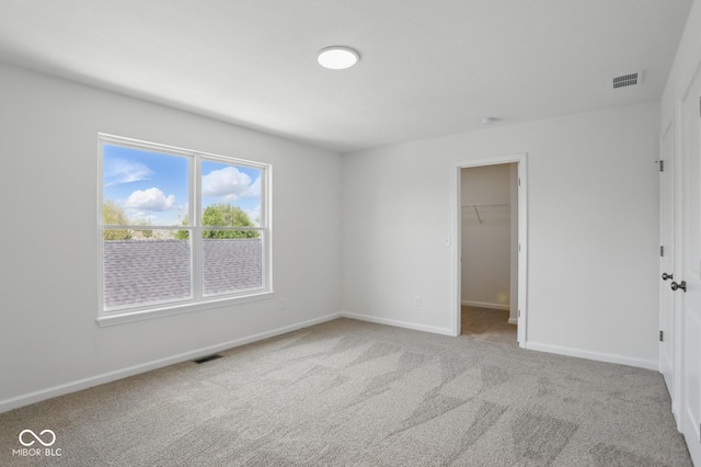 3931 Wren Dr, Brownsburg, IN 46112 - unfurnished bedroom featuring carpet, baseboards, a spacious closet, and a closet