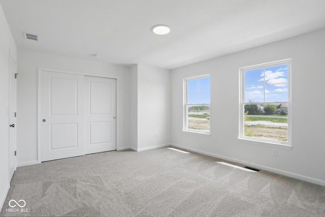 3931 Wren Dr, Brownsburg, IN 46112 - unfurnished bedroom featuring carpet flooring, baseboards, and a closet