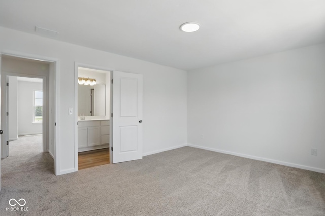 3931 Wren Dr, Brownsburg, IN 46112 - unfurnished bedroom with carpet floors, baseboards, and connected bathroom